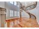 Open-concept living area featuring a grand staircase, hardwood floors, and abundant natural light at 2820 Sisteron Ct, Henderson, NV 89044