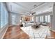 Bright living room featuring recessed lighting, hardwood floors, large windows with shutters, and open access to the kitchen at 2820 Sisteron Ct, Henderson, NV 89044