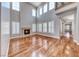 Bright living room boasting soaring ceilings, fireplace, hardwood floors, and ample natural light at 2820 Sisteron Ct, Henderson, NV 89044