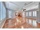 Bright living room featuring recessed lighting, hardwood floors, large windows with shutters, and open access to the kitchen at 2820 Sisteron Ct, Henderson, NV 89044