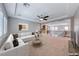 Staged living room next to the loft, featuring a comfortable sofa and coffee table at 2820 Sisteron Ct, Henderson, NV 89044