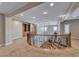 Open loft area with decorative railing and a chandelier at 2820 Sisteron Ct, Henderson, NV 89044