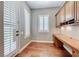 Home office with built-in desk, wood floors, and plantation shutters for enhanced privacy at 2820 Sisteron Ct, Henderson, NV 89044