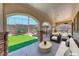 Covered patio featuring stone columns and ample seating for entertaining at 2820 Sisteron Ct, Henderson, NV 89044