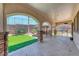 Covered patio featuring stone columns and ample seating for entertaining at 2820 Sisteron Ct, Henderson, NV 89044