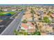 Aerial view of neighborhood shows many single-Gathering homes, a community playground, and mature landscaping at 3617 Dutch Valley Dr, Las Vegas, NV 89147