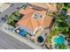 The property boasts a backyard pool, a patio cover, and an expansive red-tiled roof at 3617 Dutch Valley Dr, Las Vegas, NV 89147