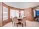 Cozy breakfast nook with brick walls, white plantation shutters, and a pendant light fixture at 3617 Dutch Valley Dr, Las Vegas, NV 89147