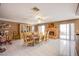 Spacious dining room with tile flooring, decorative ceiling, fireplace, and sliding glass doors at 3617 Dutch Valley Dr, Las Vegas, NV 89147