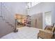 Bright foyer with tiled floor, chandelier, and access to a home gym at 3617 Dutch Valley Dr, Las Vegas, NV 89147