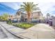 Charming home with a well-manicured lawn, mature palm tree, wrought iron fence, and inviting curb appeal at 3617 Dutch Valley Dr, Las Vegas, NV 89147
