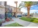 Charming home with a well-manicured front yard, a blue door, and a decorative spiral staircase at 3617 Dutch Valley Dr, Las Vegas, NV 89147