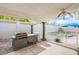 Outdoor kitchen area with a built-in grill and access to the backyard pool at 3617 Dutch Valley Dr, Las Vegas, NV 89147
