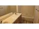 Bathroom featuring a bathtub with shower, white tile walls, and a single sink vanity at 3750 Morning Canyon St, Las Vegas, NV 89147