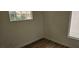 A light and airy bedroom with wood-look floors and a window at 3750 Morning Canyon St, Las Vegas, NV 89147