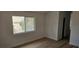 Bright bedroom featuring wood floors and a window allowing natural light at 3750 Morning Canyon St, Las Vegas, NV 89147