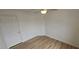 Cozy bedroom featuring wood-look floors, ceiling fan and a window at 3750 Morning Canyon St, Las Vegas, NV 89147