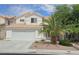 Charming two-story home with a two-car garage, tile roof and desert landscaping at 3750 Morning Canyon St, Las Vegas, NV 89147