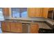 Updated kitchen featuring stainless steel appliances, granite countertops, and wood cabinetry at 3750 Morning Canyon St, Las Vegas, NV 89147
