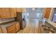 This kitchen features wood cabinets, stainless steel appliances, granite counters, and a stainless sink at 3750 Morning Canyon St, Las Vegas, NV 89147