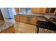 Updated kitchen featuring stainless steel appliances, granite countertops, and wood cabinetry at 3750 Morning Canyon St, Las Vegas, NV 89147