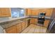 Updated kitchen featuring stainless steel appliances, granite countertops, and wood cabinetry at 3750 Morning Canyon St, Las Vegas, NV 89147