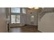 Open living area with lots of light, featuring a fireplace and hardwood floors at 3750 Morning Canyon St, Las Vegas, NV 89147