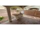 Covered outdoor kitchen with a built-in BBQ and countertops at 3750 Morning Canyon St, Las Vegas, NV 89147