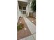 Walkway leading to front door with desert landscaping at 3750 Morning Canyon St, Las Vegas, NV 89147