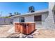 Backyard view with covered hot tub and easy to maintain desert landscaping at 4381 Toledo Ave, Las Vegas, NV 89121