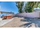 Fully fenced backyard with a covered hot tub and shade trees at 4381 Toledo Ave, Las Vegas, NV 89121