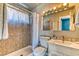 Well-maintained bathroom features tiled shower, tile floors and modern vanity at 4381 Toledo Ave, Las Vegas, NV 89121