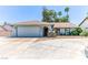 Charming single-story home featuring a two-car garage, desert landscaping, and a welcoming front entrance at 4381 Toledo Ave, Las Vegas, NV 89121
