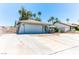 Charming single-story home featuring a two-car garage, desert landscaping, and a welcoming front entrance at 4381 Toledo Ave, Las Vegas, NV 89121