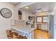 Cozy kitchen with white cabinets, stainless steel appliances and eat-in counter seating at 4381 Toledo Ave, Las Vegas, NV 89121