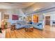 Spacious living room with vaulted ceiling, fireplace, and wood flooring at 4381 Toledo Ave, Las Vegas, NV 89121