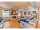 Spacious living room with vaulted ceiling, fireplace, and wood flooring at 4381 Toledo Ave, Las Vegas, NV 89121