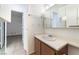 Bathroom featuring a vanity, mirror, and doorway to bedroom with tiled floors at 440 Elm Dr # 103, Las Vegas, NV 89169