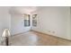 Bright bedroom with tiled floors, two windows, and a modern air conditioning unit at 440 Elm Dr # 103, Las Vegas, NV 89169