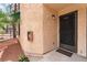 Attractive condo entrance with a decorative security door and a convenient fire extinguisher box at 440 Elm Dr # 103, Las Vegas, NV 89169