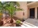 Inviting front entrance with vibrant landscaping and stylish door with security gate for a welcoming curb appeal at 440 Elm Dr # 103, Las Vegas, NV 89169