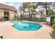A stunning turquoise pool is surrounded by lounge chairs and lush trees creating a relaxing retreat at 440 Elm Dr # 103, Las Vegas, NV 89169