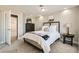 Bedroom with plush carpet, dresser, and stylish decorations, creating a cozy and inviting atmosphere at 445 Concord Way, Henderson, NV 89015