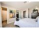 Bedroom featuring modern design, plush bedding, and convenient access to a well-appointed bathroom at 445 Concord Way, Henderson, NV 89015
