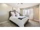 Bedroom with cozy carpet and stylish furnishings, offering a comfortable and inviting space at 445 Concord Way, Henderson, NV 89015