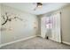 Bedroom with neutral walls, modern lighting, and minimalist decorations, offering a versatile space at 445 Concord Way, Henderson, NV 89015