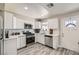 Bright kitchen featuring new stainless steel appliances, white cabinets, and modern finishes at 445 Concord Way, Henderson, NV 89015