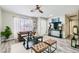 Cozy living room with wood floors, large window, modern decor, and stylish furniture at 445 Concord Way, Henderson, NV 89015
