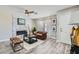 Comfortable living room featuring an electric fireplace and access to the front door at 445 Concord Way, Henderson, NV 89015