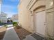 Charming condo exterior with a front door and well-maintained landscaping at 4675 Color Up Ct # 101, Las Vegas, NV 89122